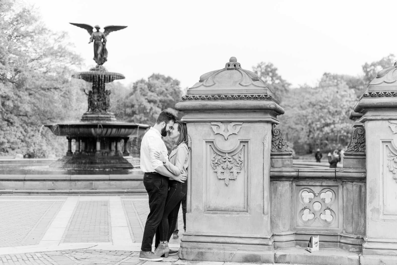 Engaged couple in Central Park engagement photos