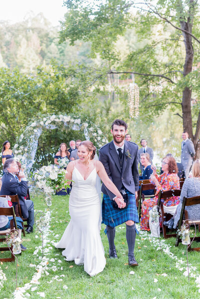 Bride and groom on Virginia wedding day with wedding florals