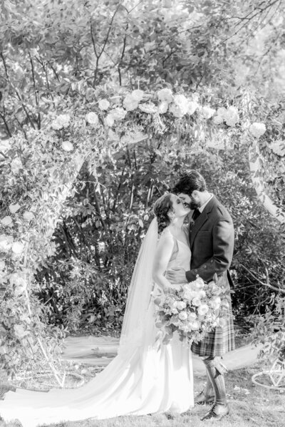 Bride and groom on Virginia wedding day with wedding florals