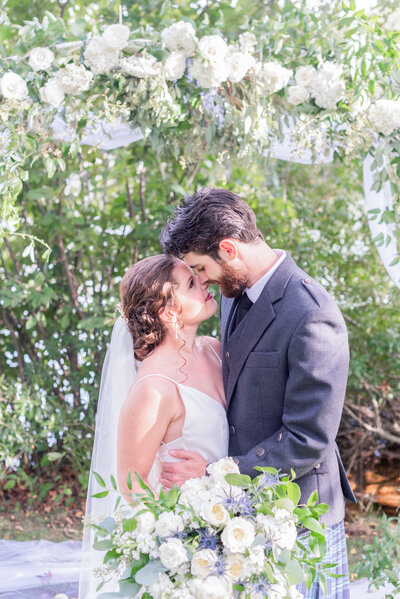 Bride and groom on Virginia wedding day with wedding florals