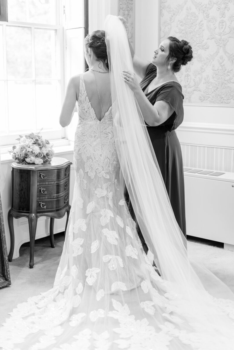 Bride getting in wedding dress at Snug Harbor on wedding day