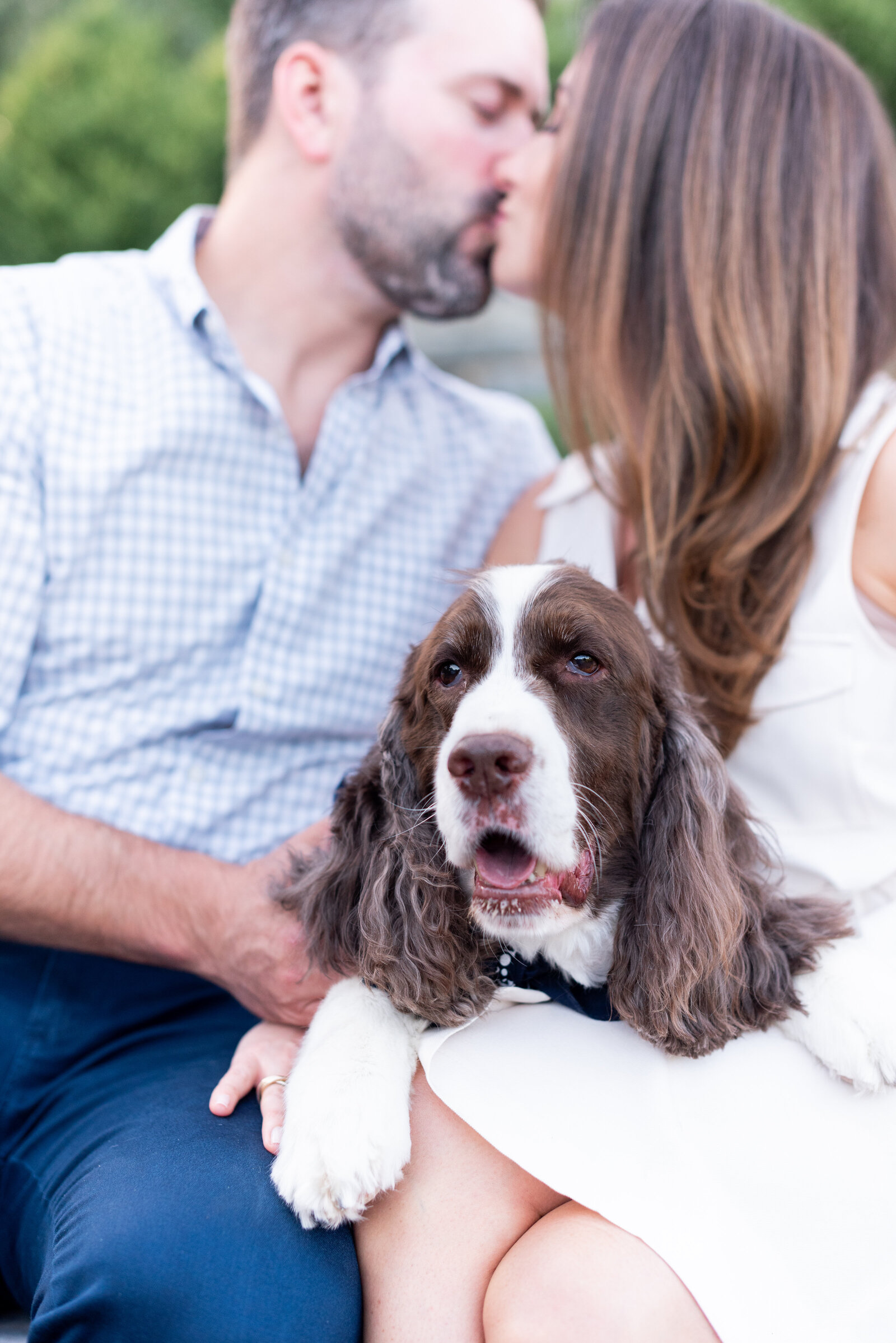 engaged couple taking engagement photos at National Cathedral engagement session