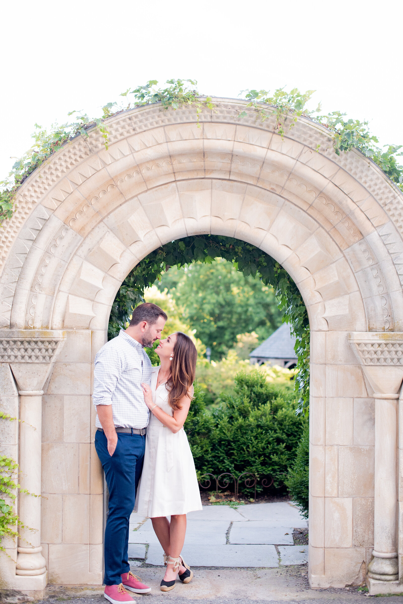 engaged couple taking engagement photos at National Cathedral engagement session