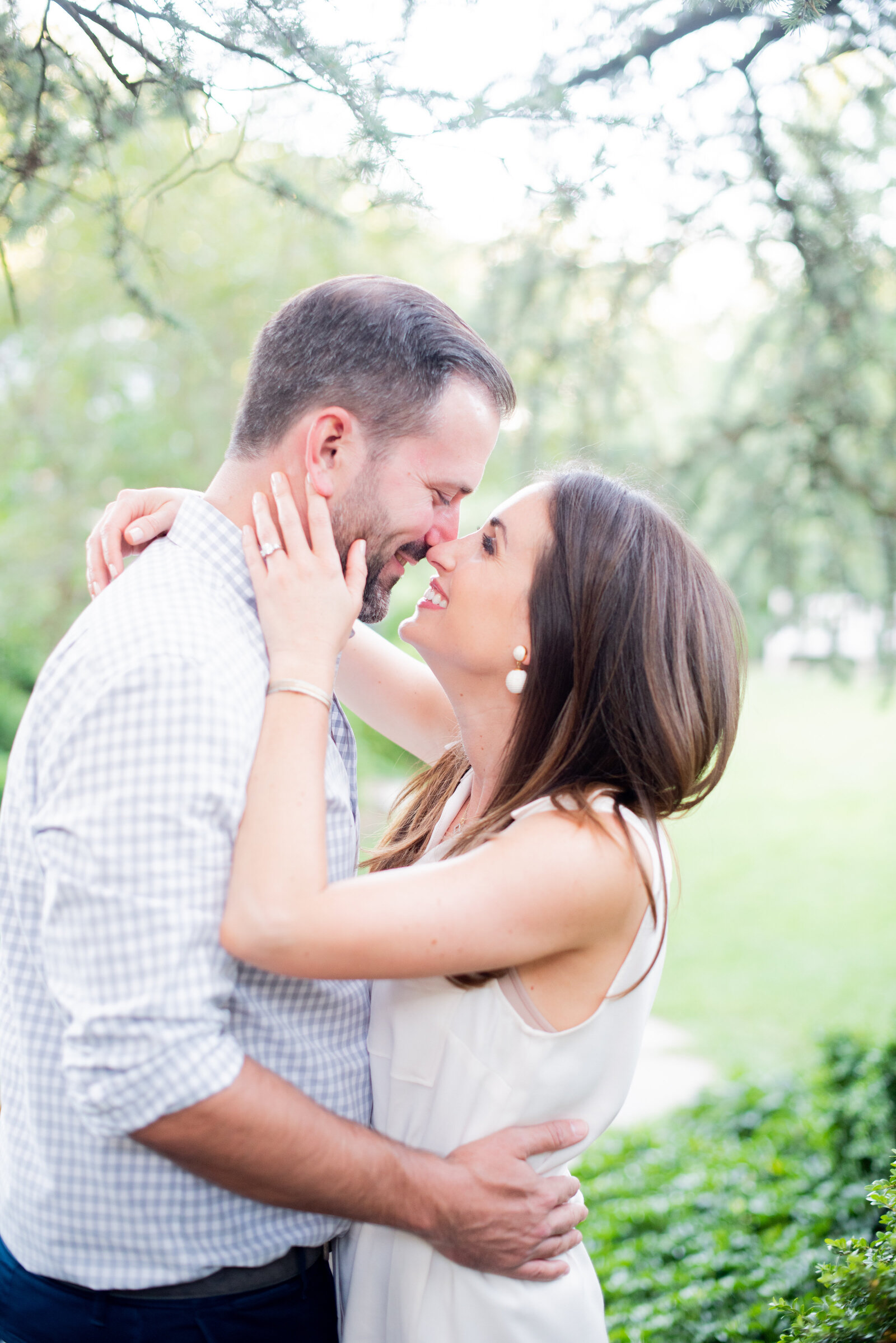 engaged couple taking engagement photos at National Cathedral engagement session