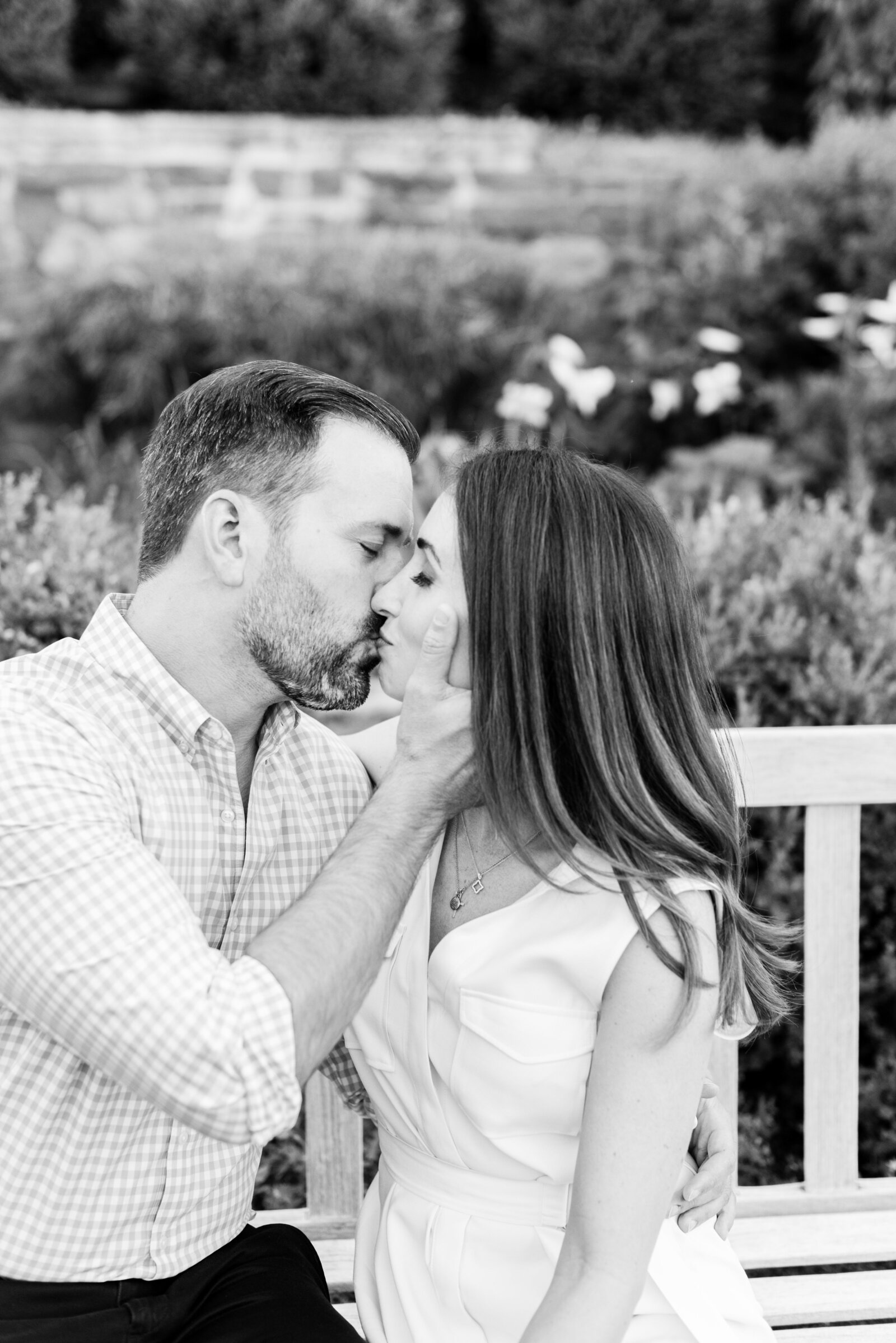 engaged couple taking engagement photos at National Cathedral engagement session